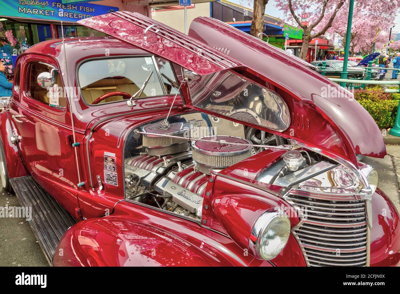 A 1938 Chevrolet Coupe with gleaming maroon bodywork, seen at an outdoor classic car show in Tauranga, New Zealand. September 22 2018 Stock Photo