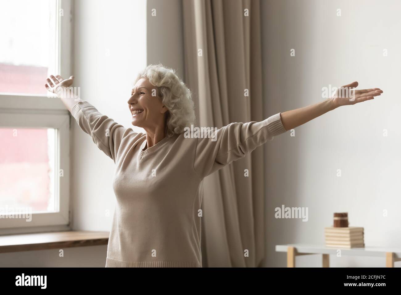 Woman arms outstretched mature hi-res stock photography and images - Alamy