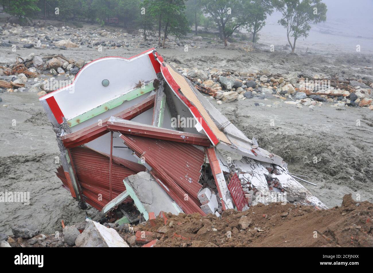 India Disaster. Heavy rainfall causes flood.Cause harm to many lives. Cloudburst in India. River flowing above red alert. Stock Photo