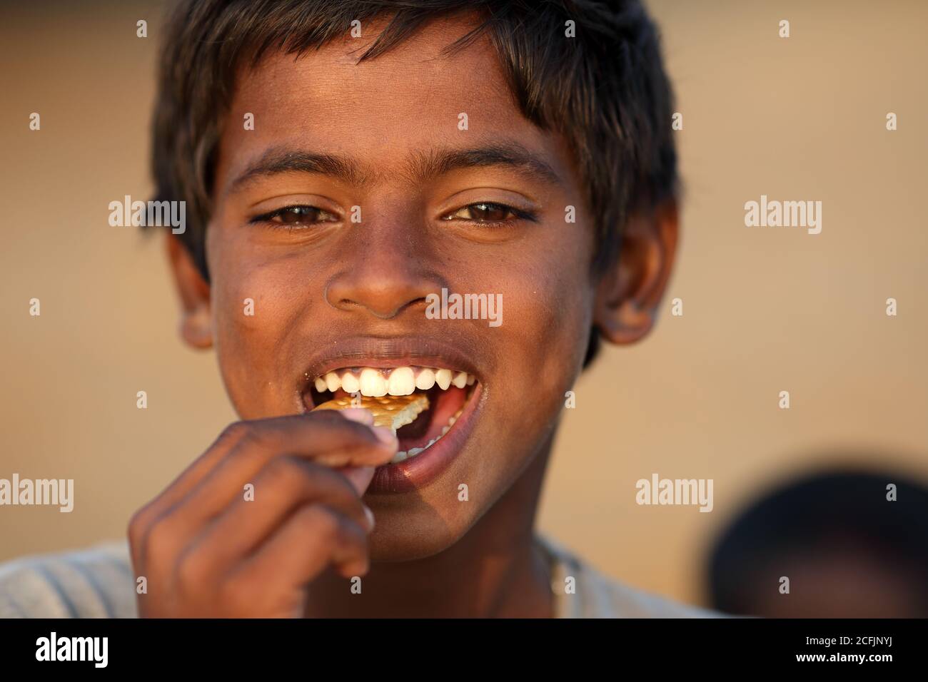 Boy on the beach near the traditional fishing colony in Puri, Odisha, India Stock Photo