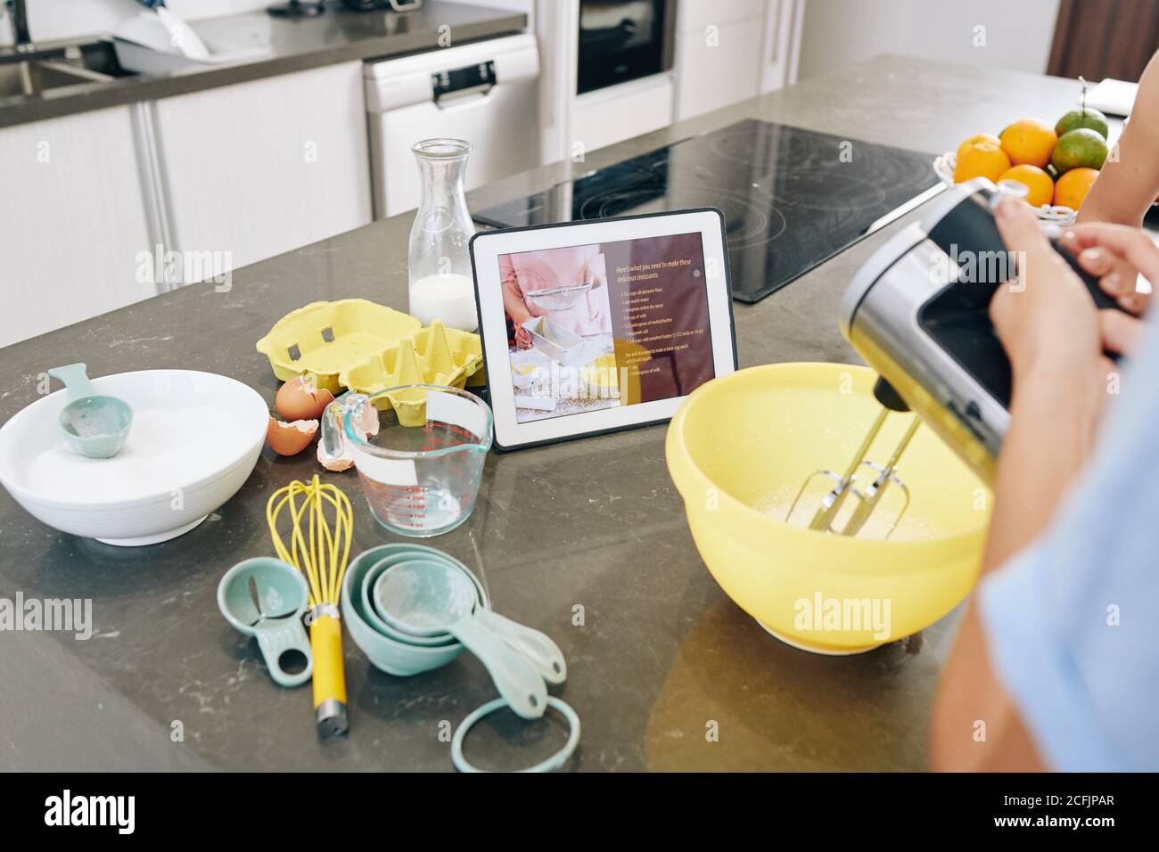 Following recipe on tablet Stock Photo