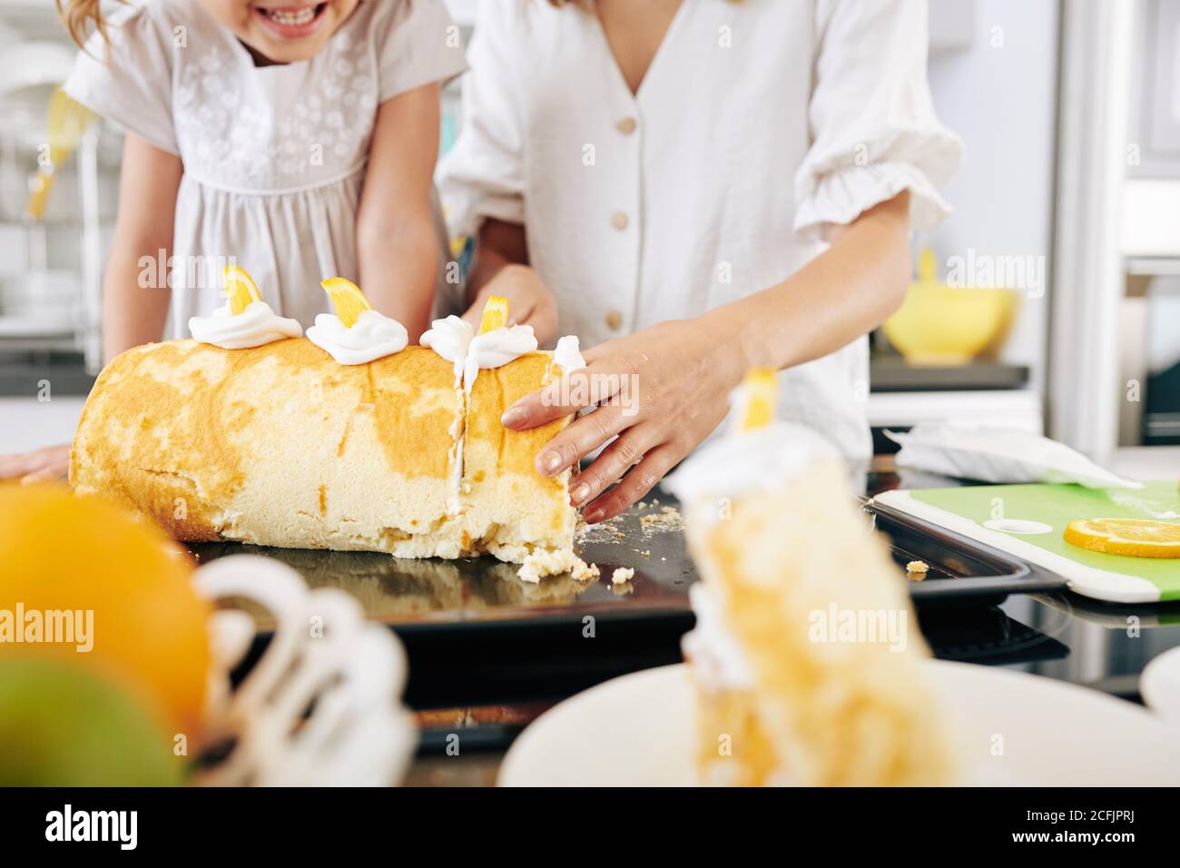 Cutting homemade biscuit roll Stock Photo