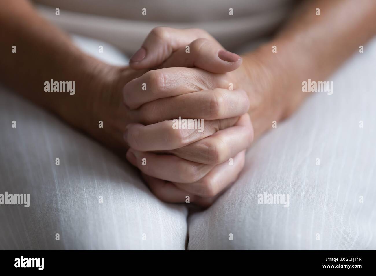 Folded hands hi-res stock photography and images - Alamy