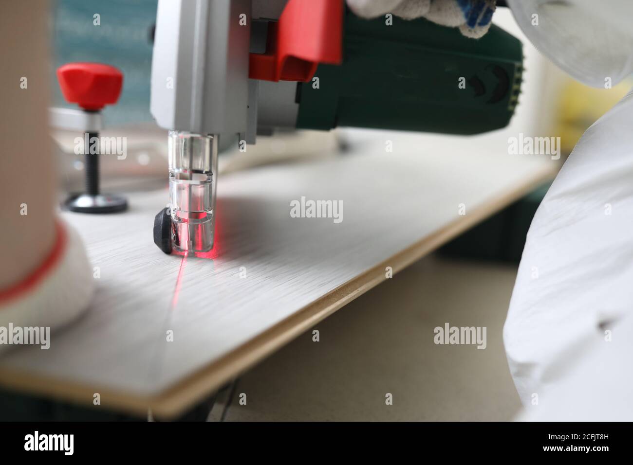 Master cuts laminate with laser cutting machine Stock Photo Alamy