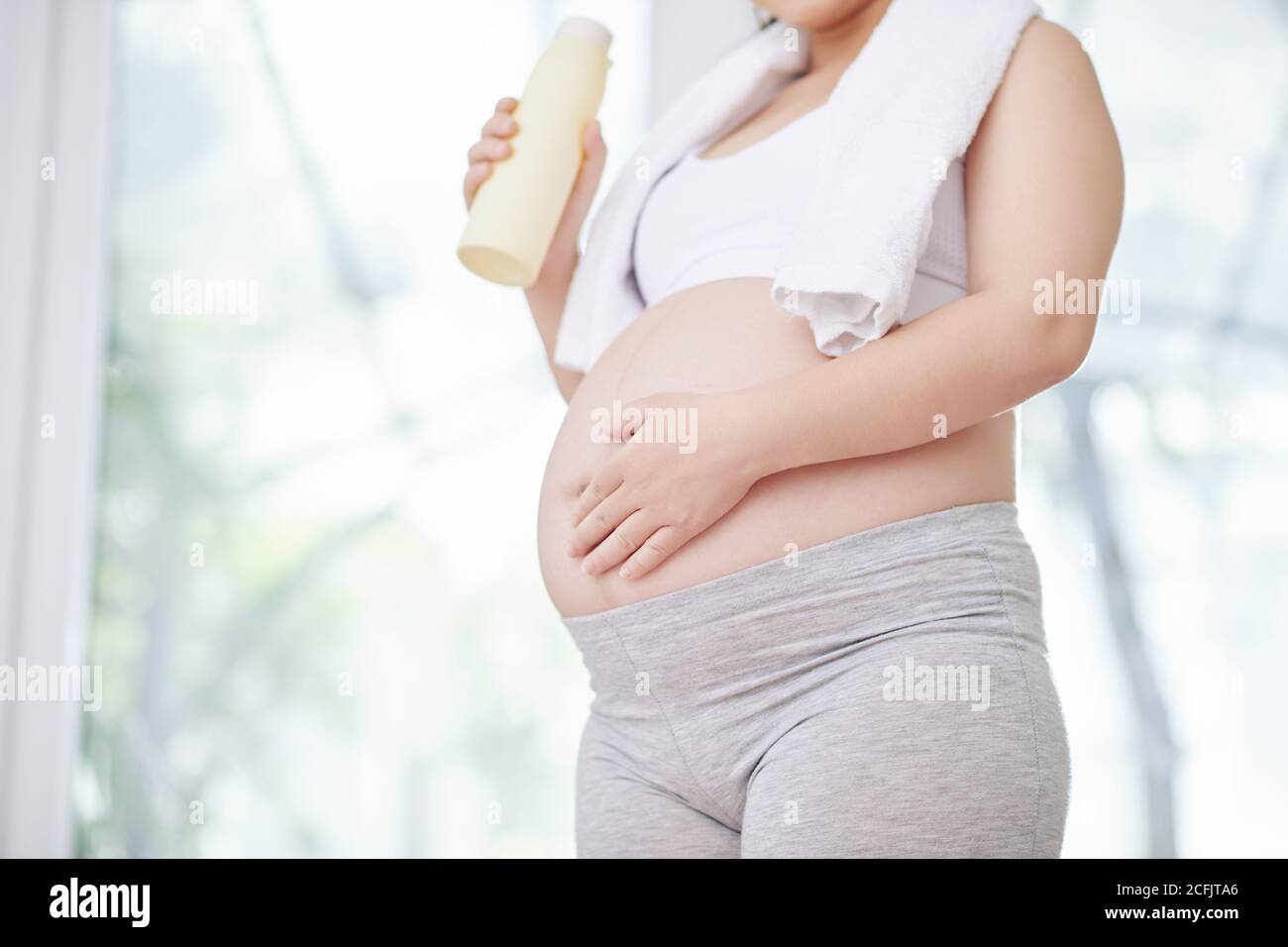 Pregnant woman drinking water Stock Photo Alamy