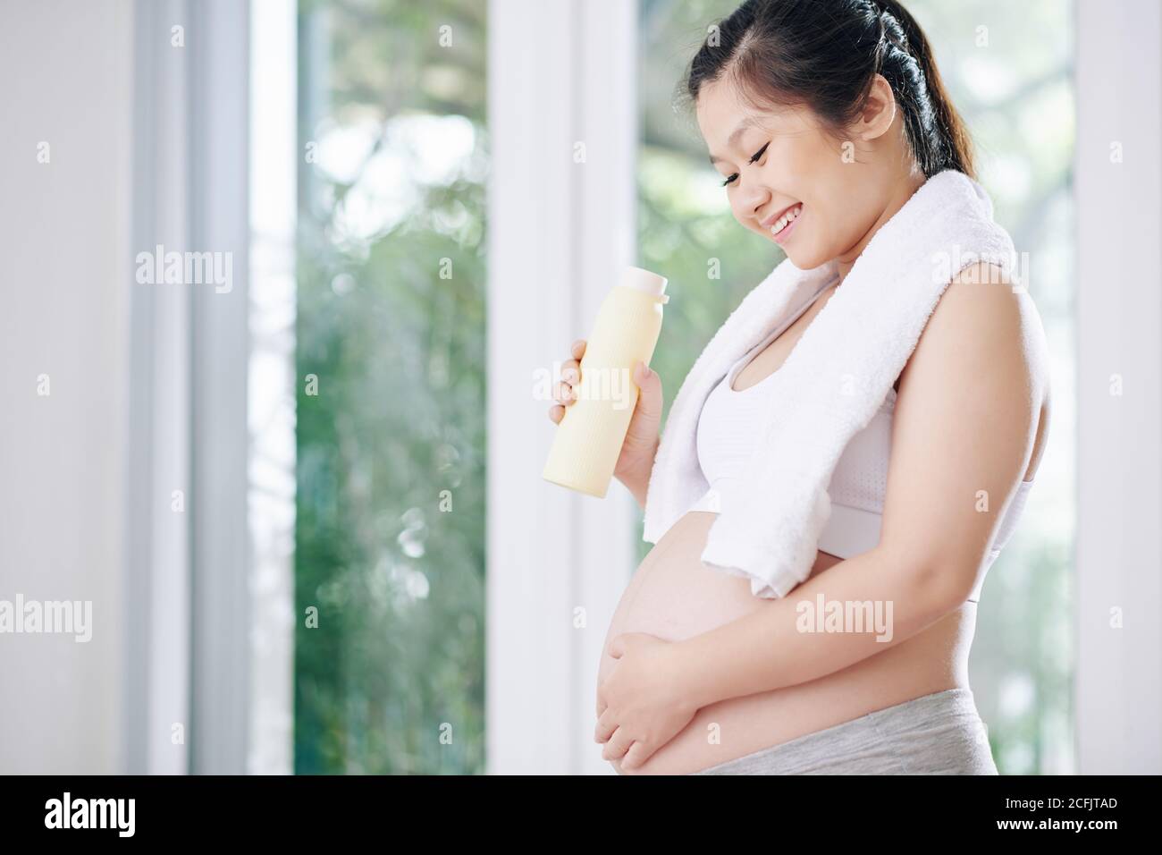 Pregnant woman drinking water Stock Photo Alamy