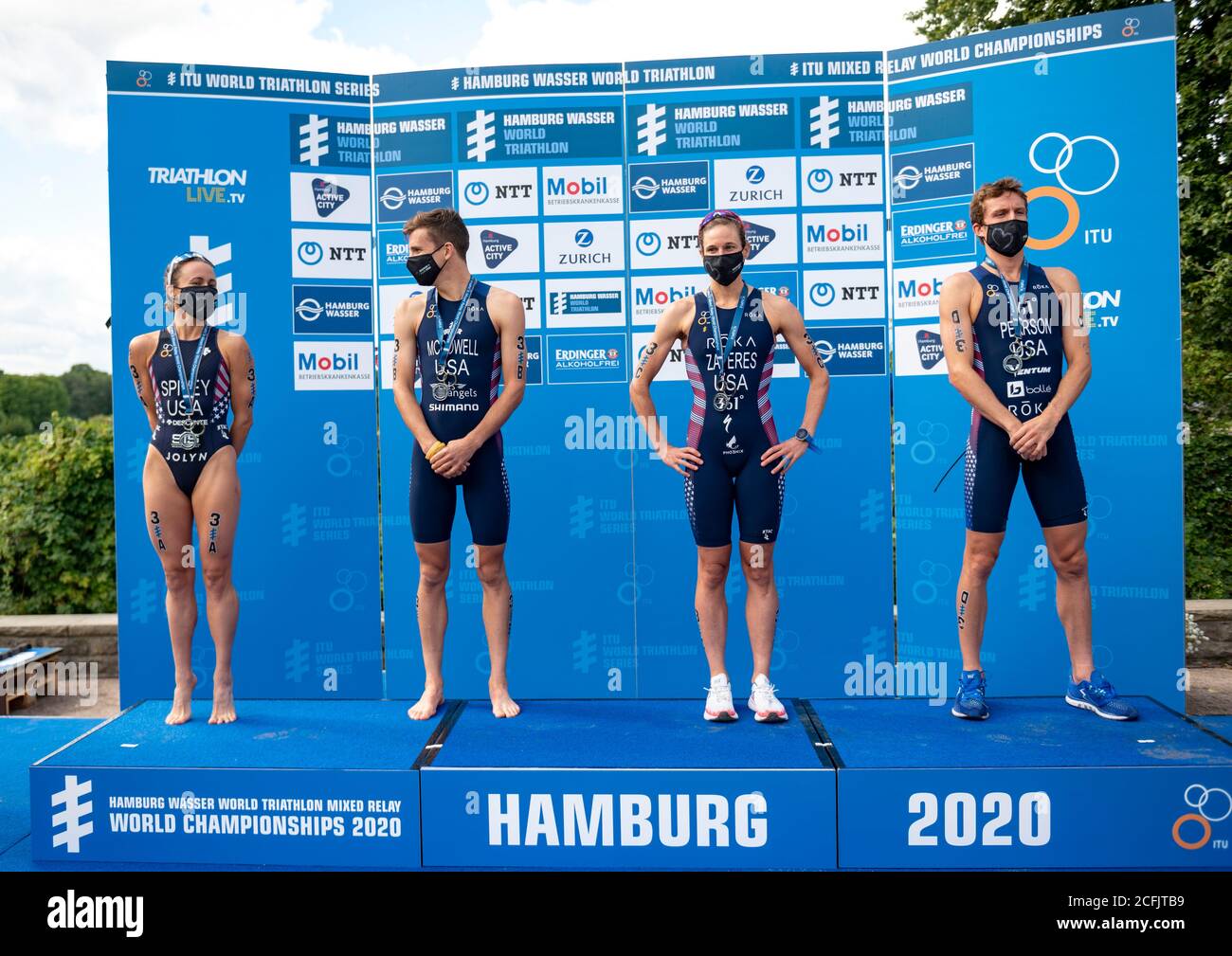 Hamburg, Germany. 06th Sep, 2020. Triathlon: ITU World Triathlon Series/World Championship, Mixed. The US team Taylor Spivey (l-r), Barclay Izzard, Jessica Learmonth and Morgan Pearson are on the podium after winning the silver medal at the World Championship. Credit: Axel Heimken/dpa/Alamy Live News Stock Photo