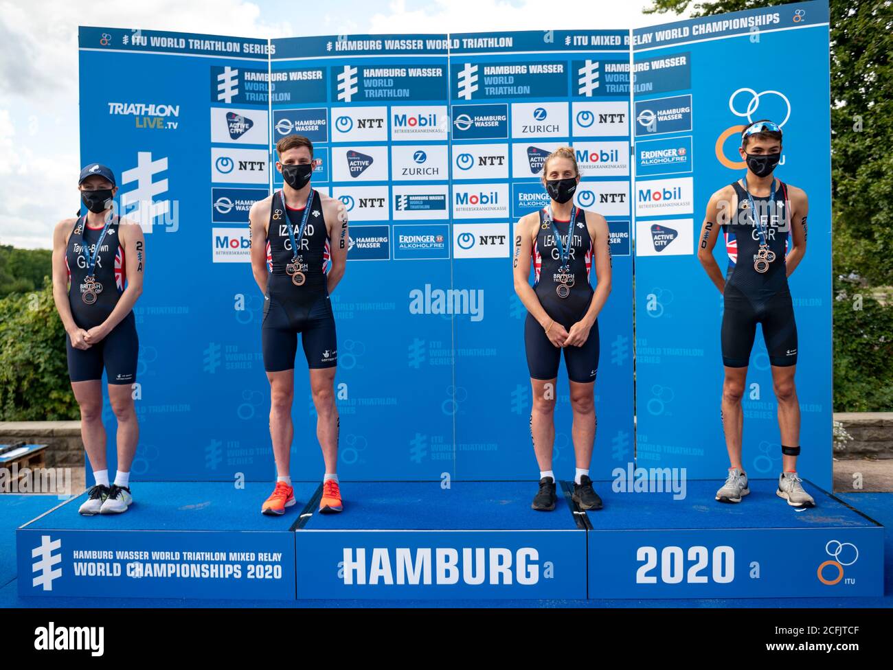 Hamburg, Germany. 06th Sep, 2020. Triathlon: ITU World Triathlon Series/World Championship, Mixed. The British team Georgia Taylor-Brown (l-r), Barclay Izzard, Jessica Learmonth and Alex Yee are on the podium after winning the bronze medal at the World Championship. Credit: Axel Heimken/dpa/Alamy Live News Stock Photo