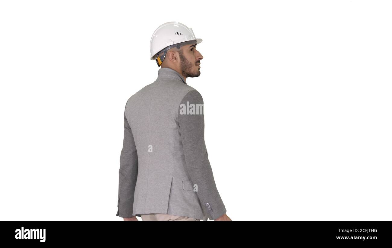 Engineer in helmet with briefcase walking on white background. Stock Photo