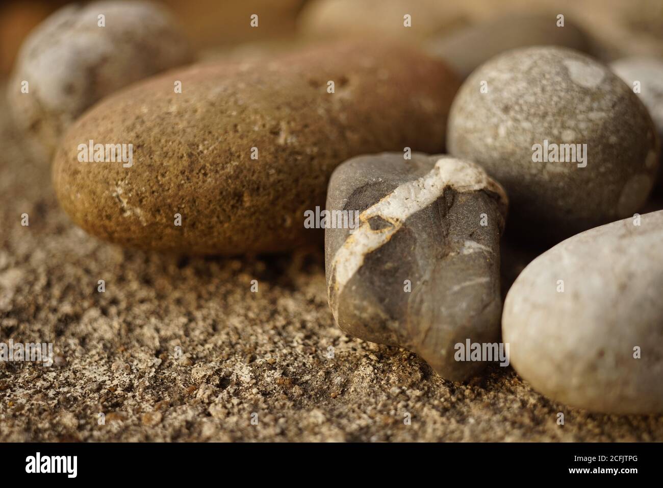 pebble stones closeup on the stone table Stock Photo