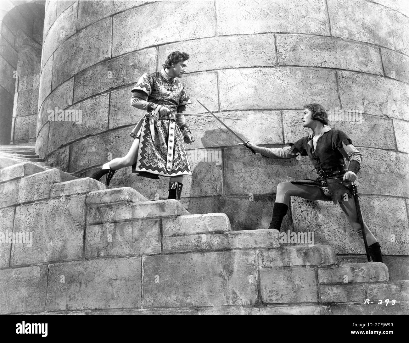 BASIL RATHBONE and ERROL FLYNN in climactic duel in THE ADVENTURES OF ROBIN HOOD 1938 directors MICHAEL CURTIZ and WILLIAM KEIGHLEY music Erich Wolfgang Korngold Warner Bros. Stock Photo