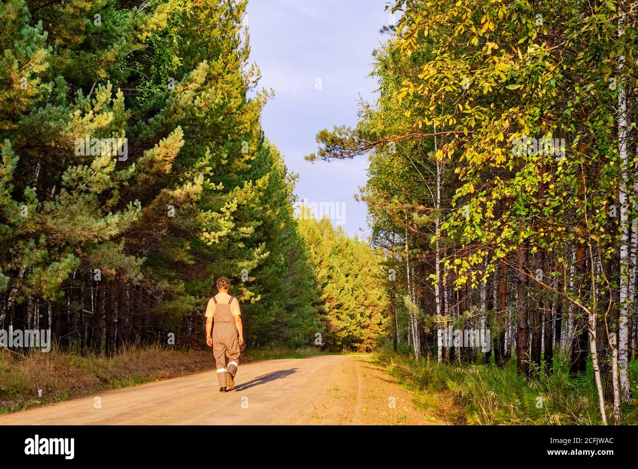 One man walking along road hi-res stock photography and images - Alamy