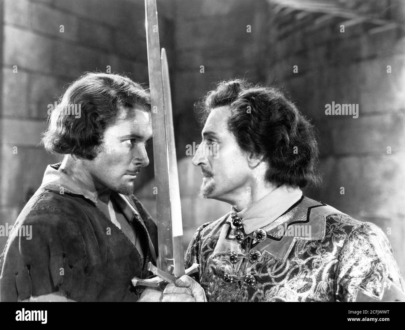 ERROL FLYNN and BASIL RATHBONE in climactic duel in THE ADVENTURES OF ROBIN HOOD 1938 directors MICHAEL CURTIZ and WILLIAM KEIGHLEY music Erich Wolfgang Korngold Warner Bros. Stock Photo