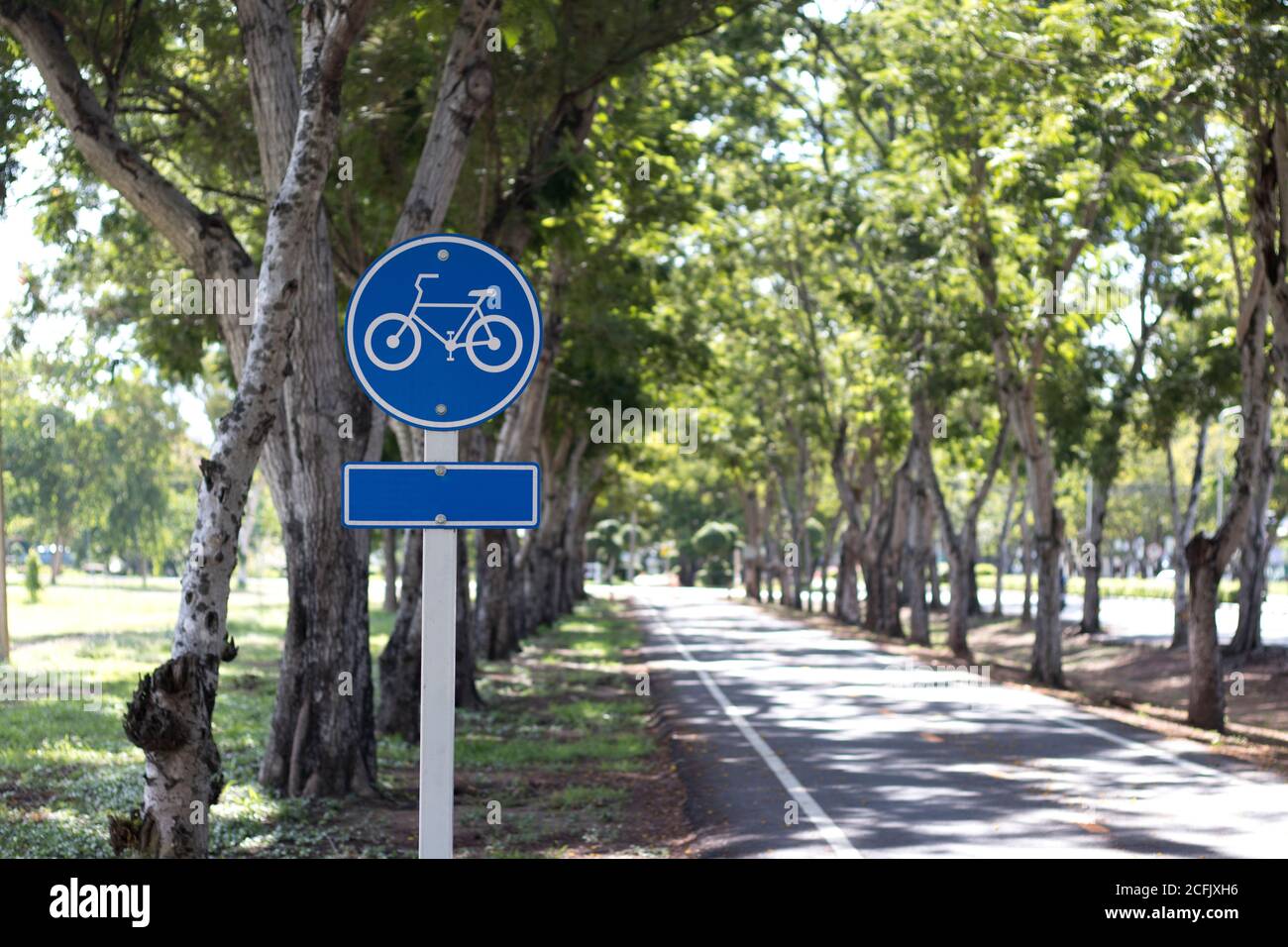 Signboard showing bike lane in a park. Stock Photo