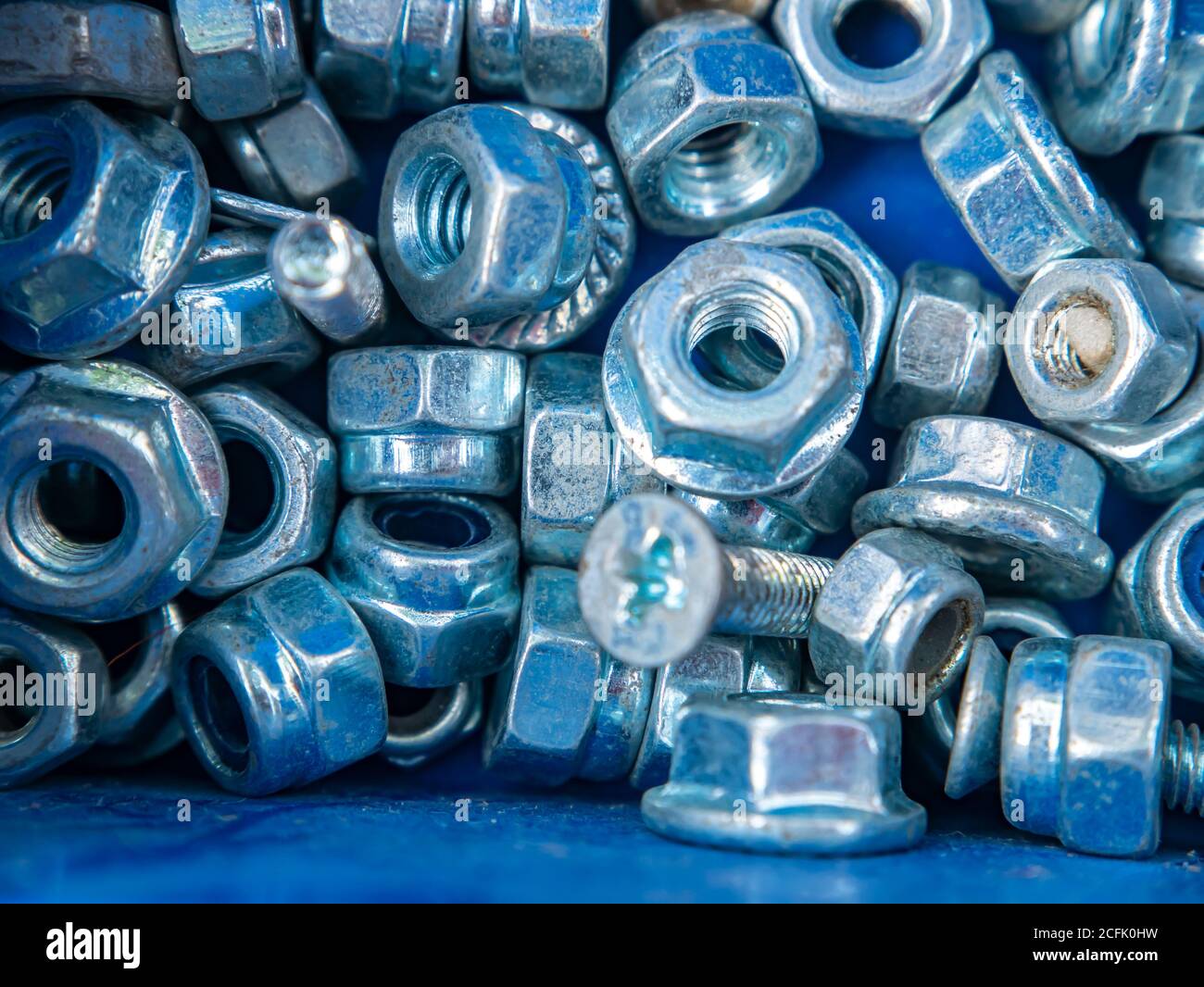 Threaded iron nut for screwing onto the bolt Stock Photo Alamy