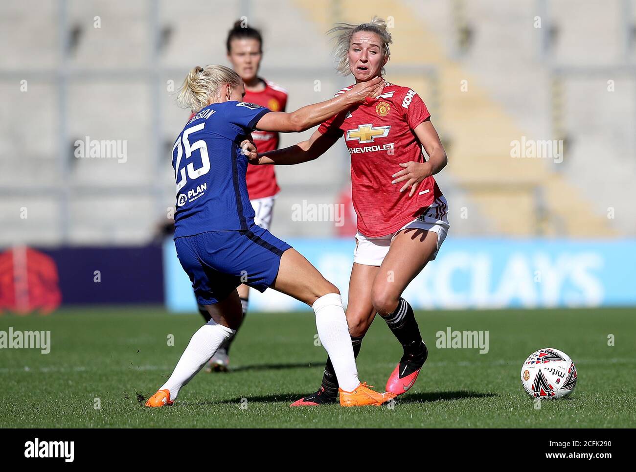 Chelsea's Jonna Andersson (left) grabs Manchester United's Jackie Groenen as they battle for the ball during the FA Women's Super League match at Leigh Sports Village Stadium, Manchester. Stock Photo