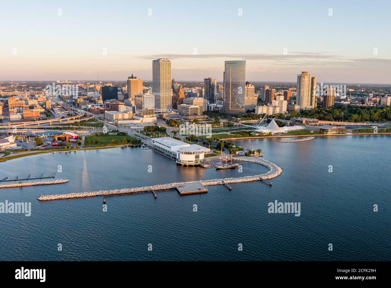 Milwaukee, WI - 3 September 2020:  Image from a drone of the Milwaukee skyline from lake Michigan during sunrise including US Bank, Milwaukee Art Muse Stock Photo