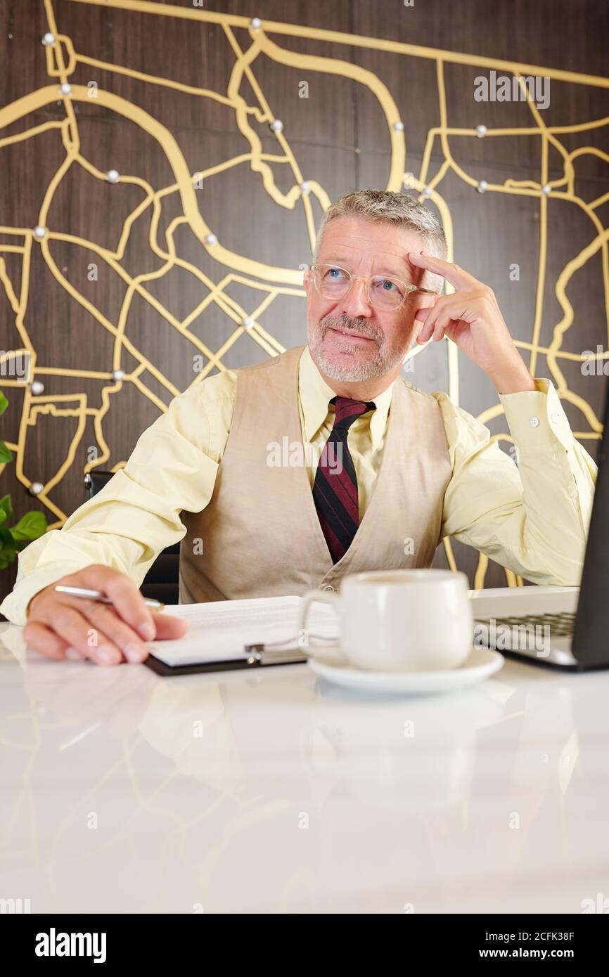 Man working on business plan Stock Photo