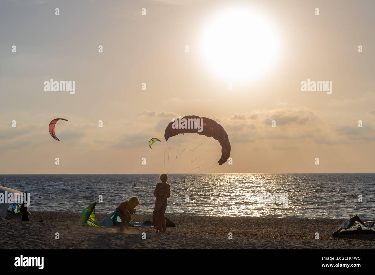 Kite surfing or kite boarding on Agios Ioannis Beach. A popular extreme  sport on this Greek Ionian island Stock Photo - Alamy