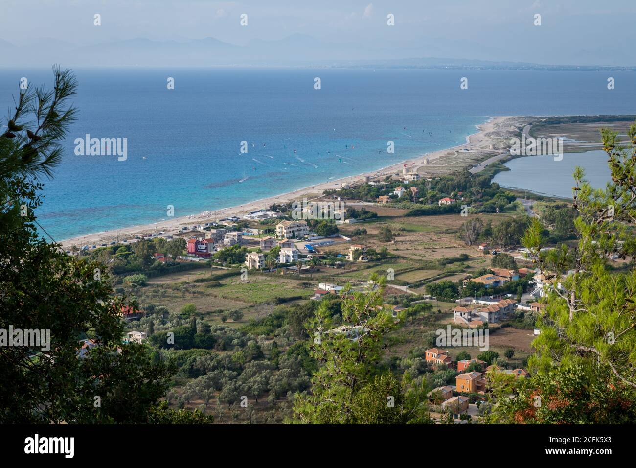 A hillside view of Agios Ioannis beach in Gyra, the location for kite surfing on this Ionian Greek island. Stock Photo