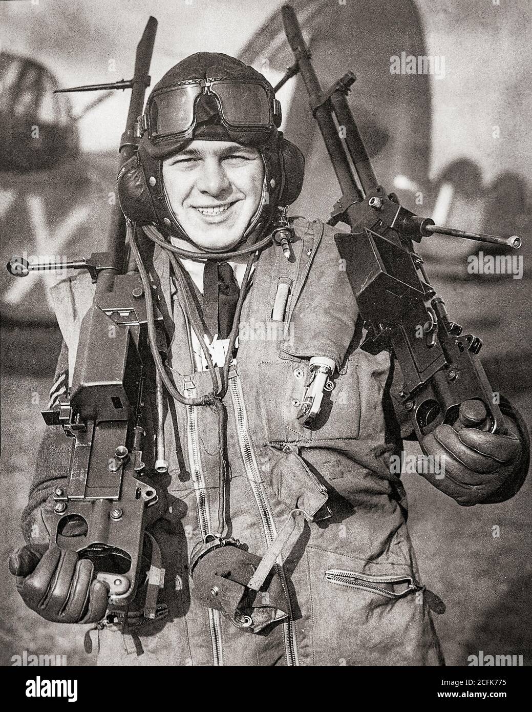 Air crew gunner with a pair of 0.303 Vickers K machine guns, aka Vickers Gas Operated (Vickers G.O.). A rapid-firing machine gun developed for use in heavy bombers it gave the  high rate of fire  needed for the small period of time when the gunner would be able to fire at an attacking aircraft. Stock Photo