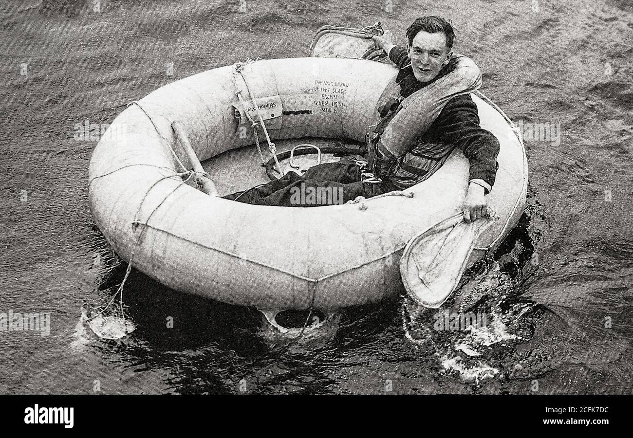 Wearing a Mae West lifejacket, an airman  in a H type dinghy awaits rescue. It was stored in the wings of most aircraft and inflated automatically when a handle was pulled. Stock Photo