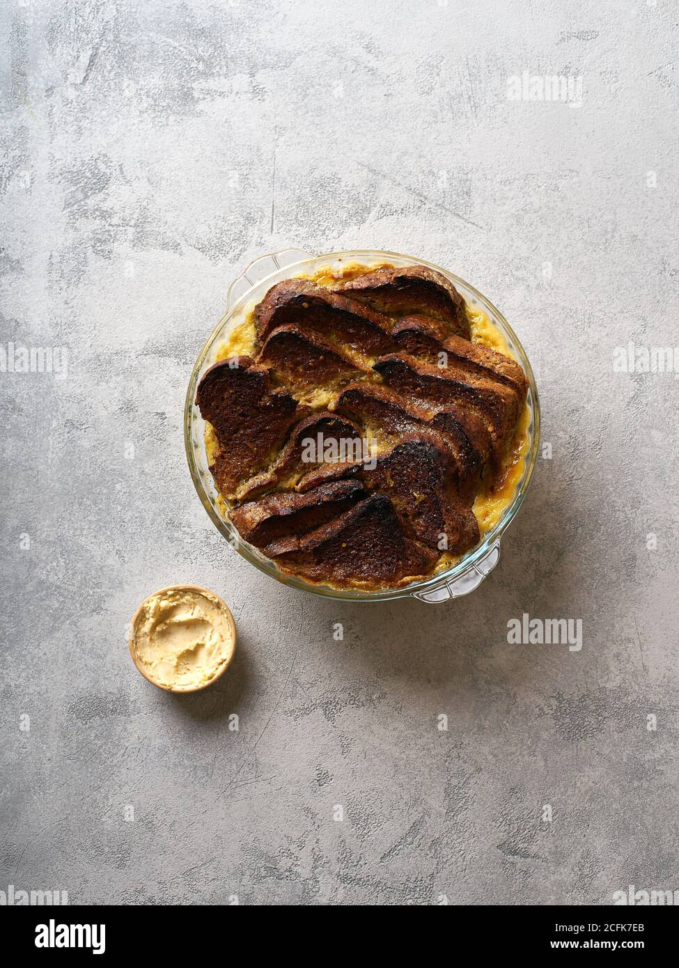 Top view of traditional bread pudding with custard, served with