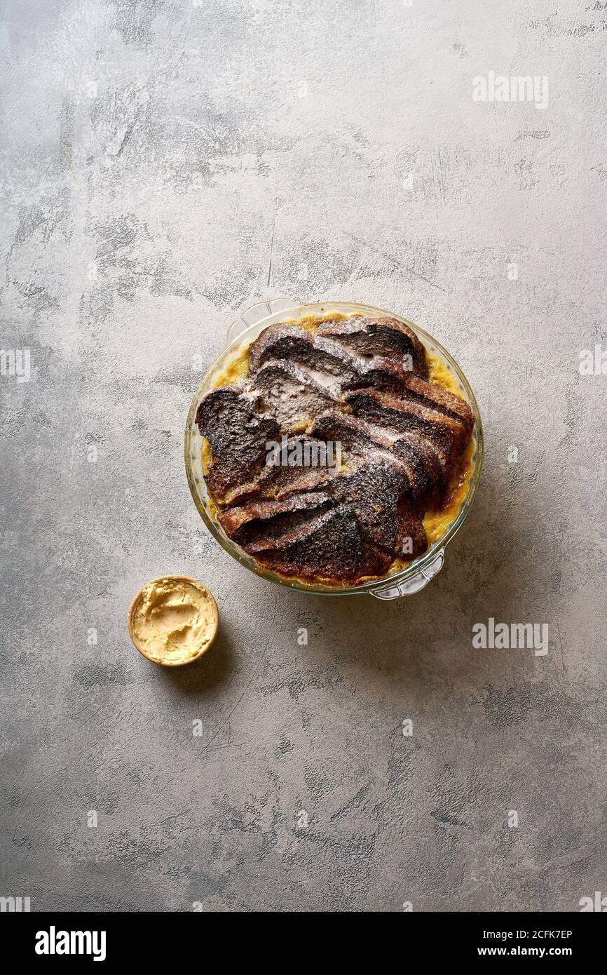Top view of traditional bread pudding with custard, served with