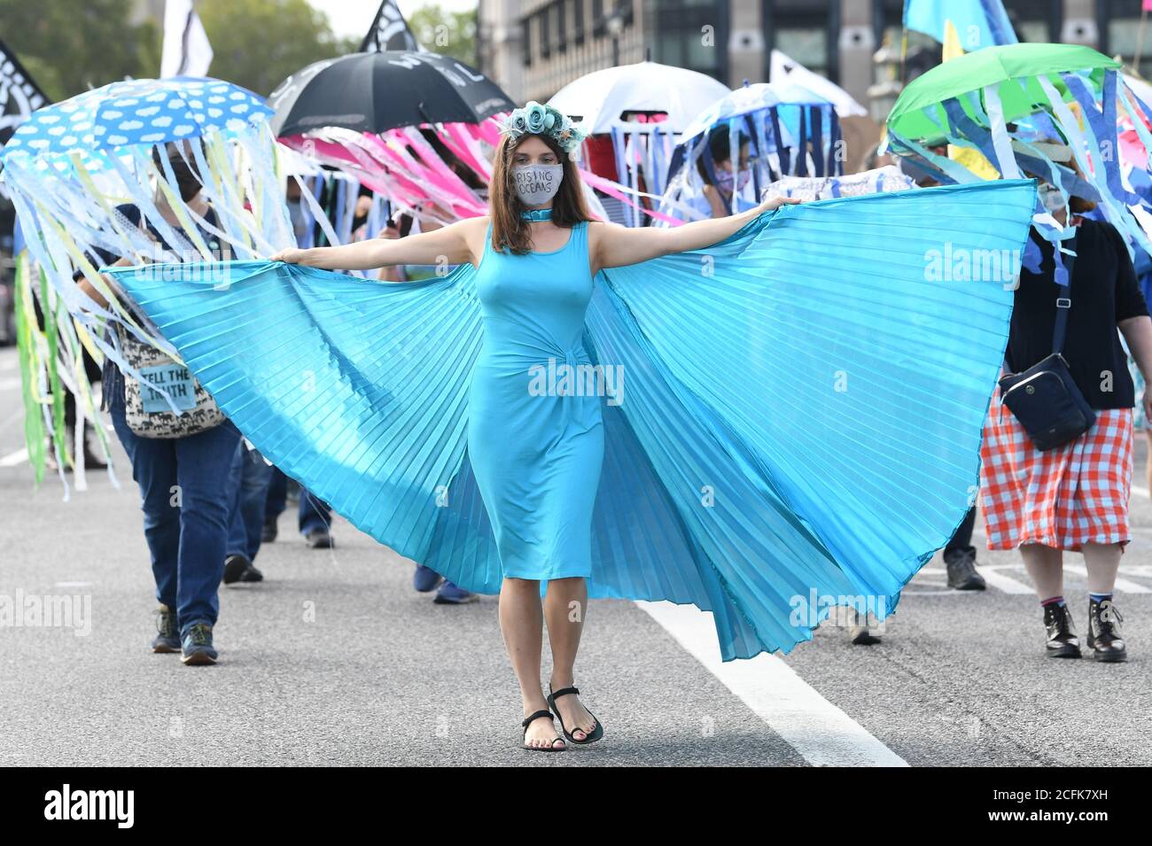 Protesters take part during a marine extinction march, part of an Extinction Rebellion protest in Westminster, central London. Stock Photo