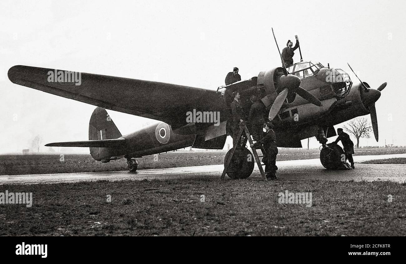 WW2 Photo of German personnel examining parked plane. WW2 Photo of German personnel examining parked plane.
