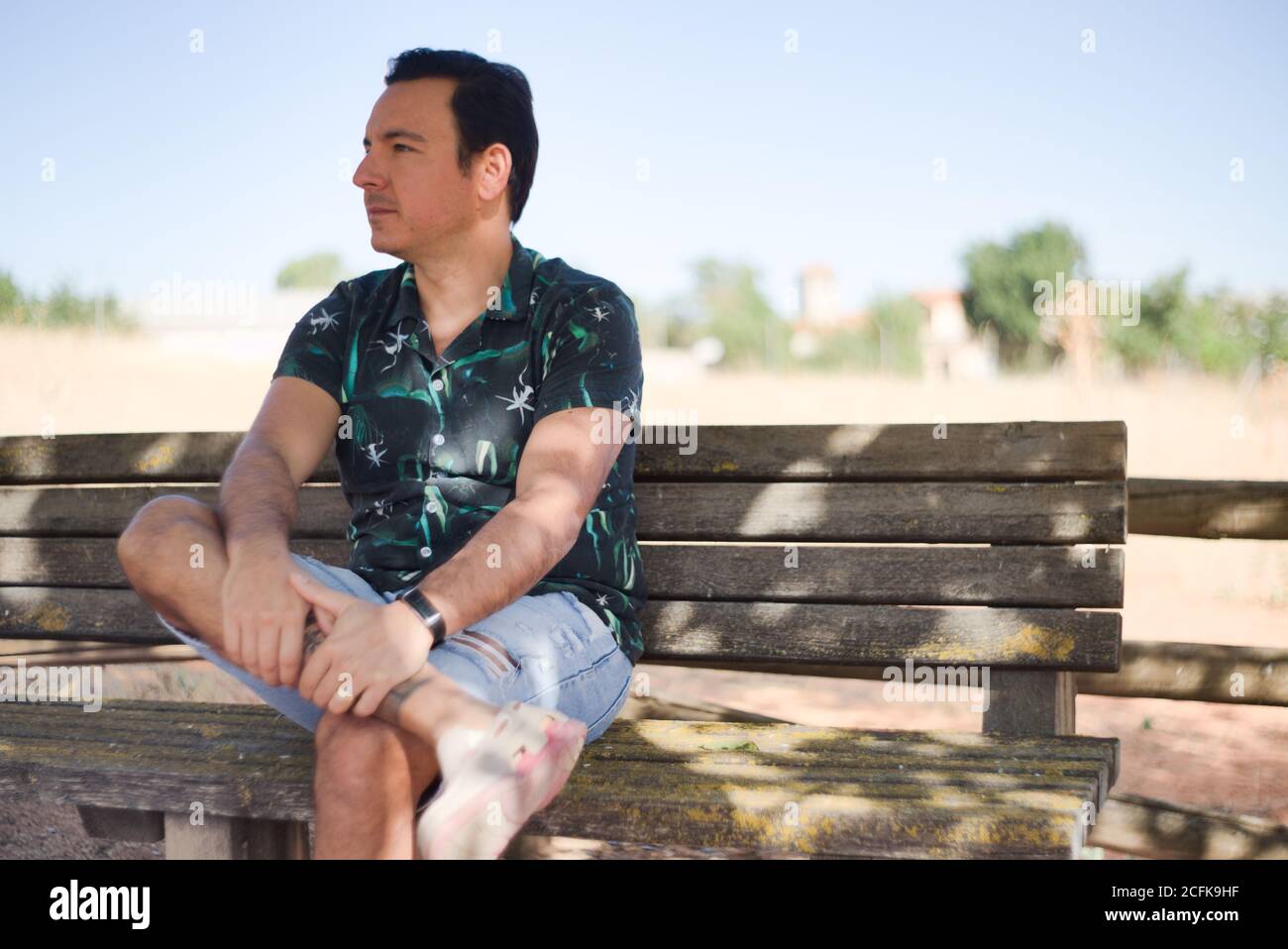 Man with positive and thoughtful attitude in an outdoor location. Stock Photo