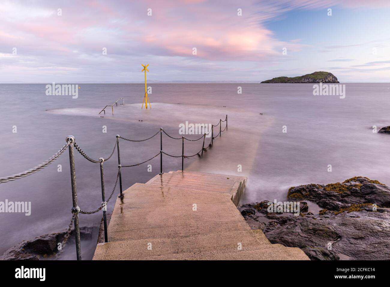 The Old Pier at North Berwick looking toward Craigleith Island. The pier is  close to the Scottish Seabird Centre who run regular trips to the islands Stock Photo