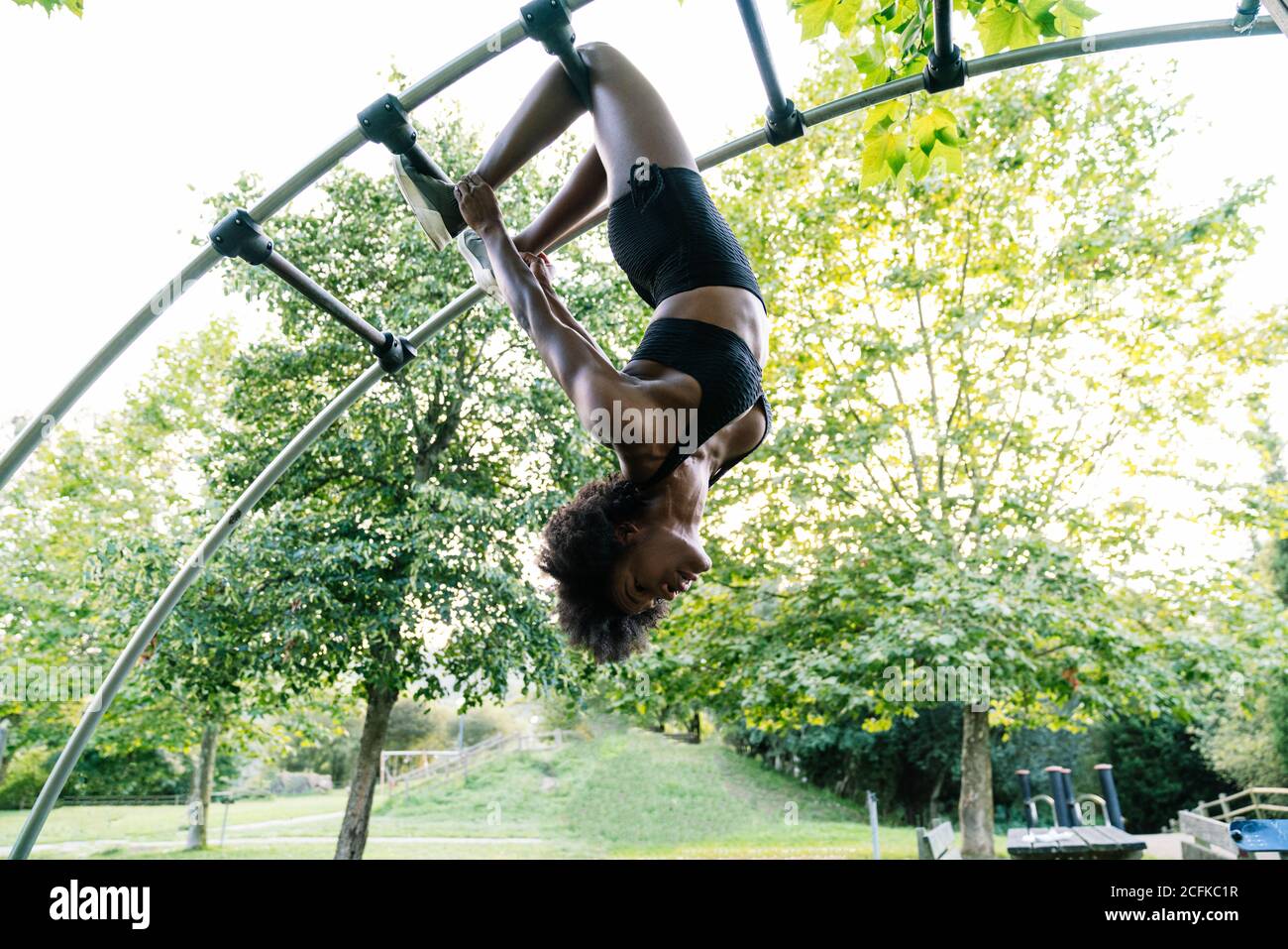 Young woman hanging upside down hi res stock photography and