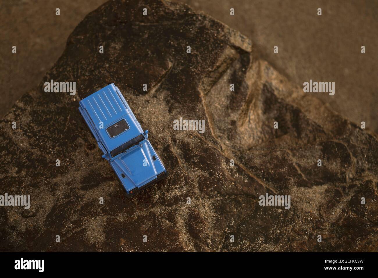Izmir, Turkey - August 22, 2020: Close up shot of a Land Rover SUV vehicle on a rock and on sunset. Stock Photo