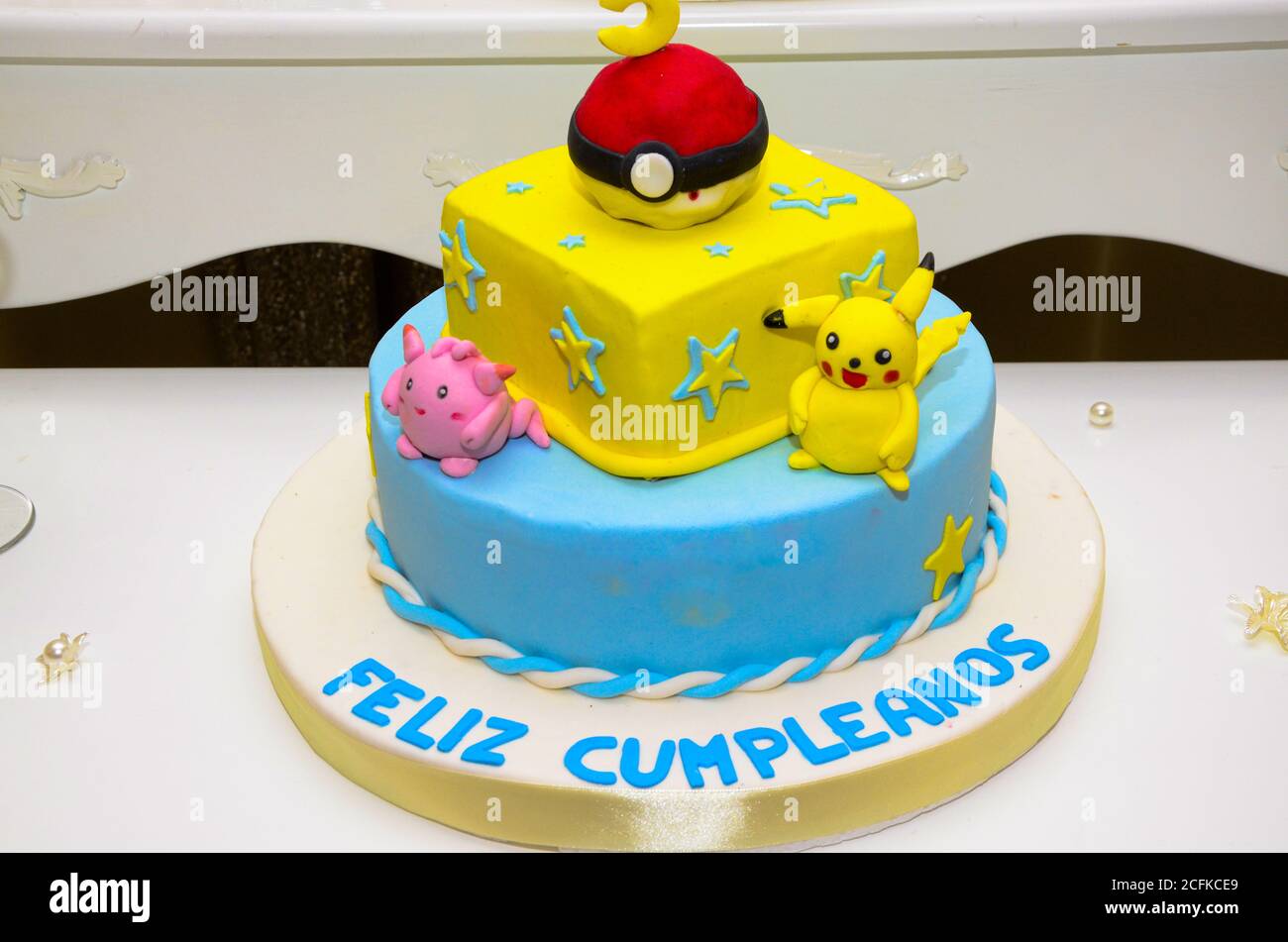 Colorful kids birthday cake decorated with yellow cartoon characters Stock  Photo - Alamy