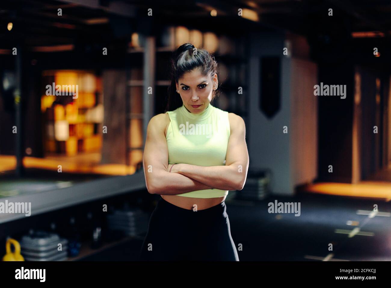 Muscular woman arms crossed hi-res stock photography and images - Alamy