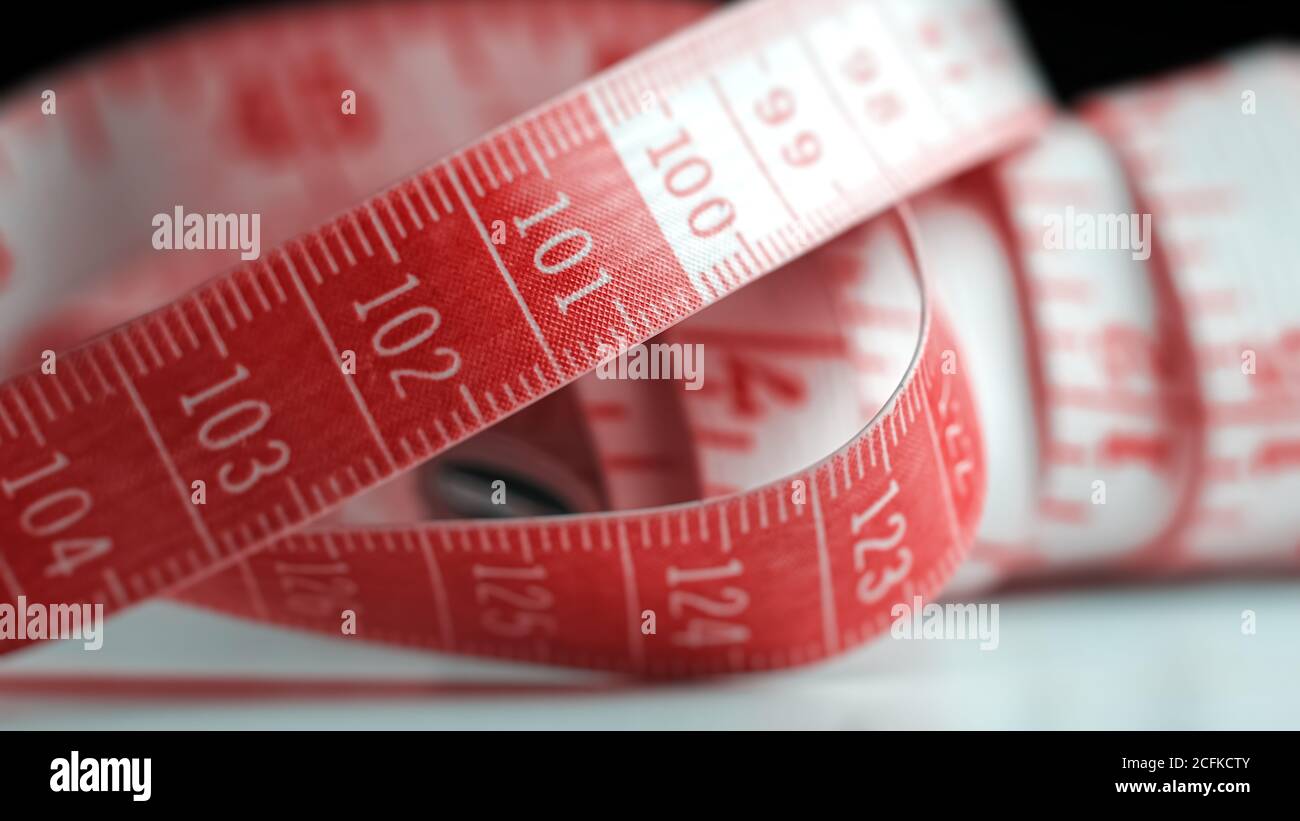 Red and white centimeter tape. Numbers with tick marks on a tailor's tape Stock Photo