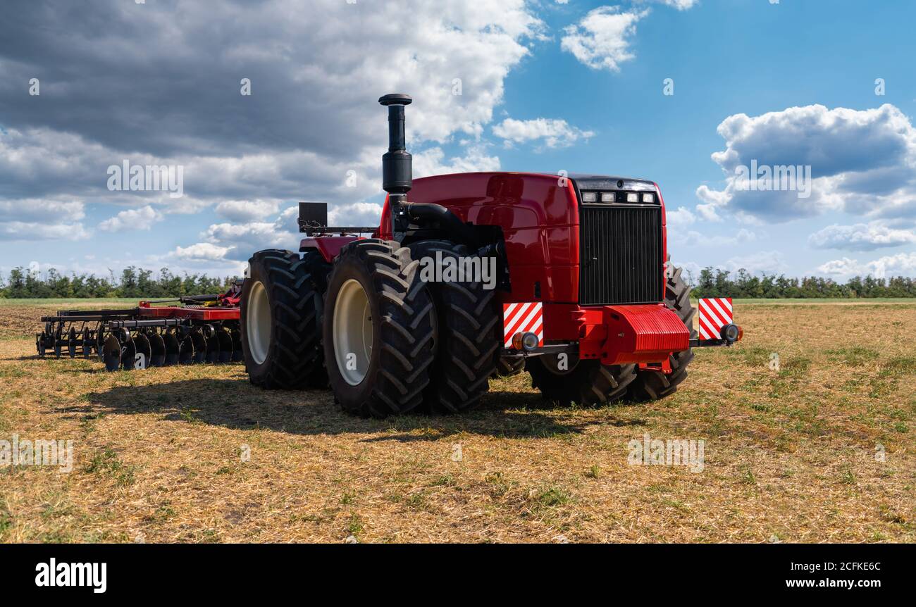 Autonomous tractor working on the field. Smart farming  Stock Photo