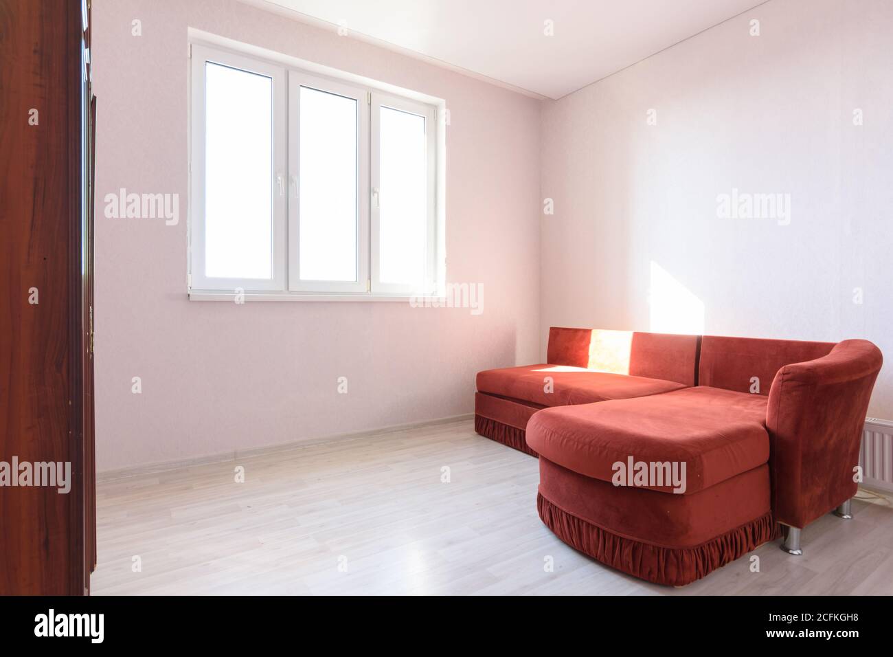 Interior of a bright room with an old sofa in the bedroom Stock Photo