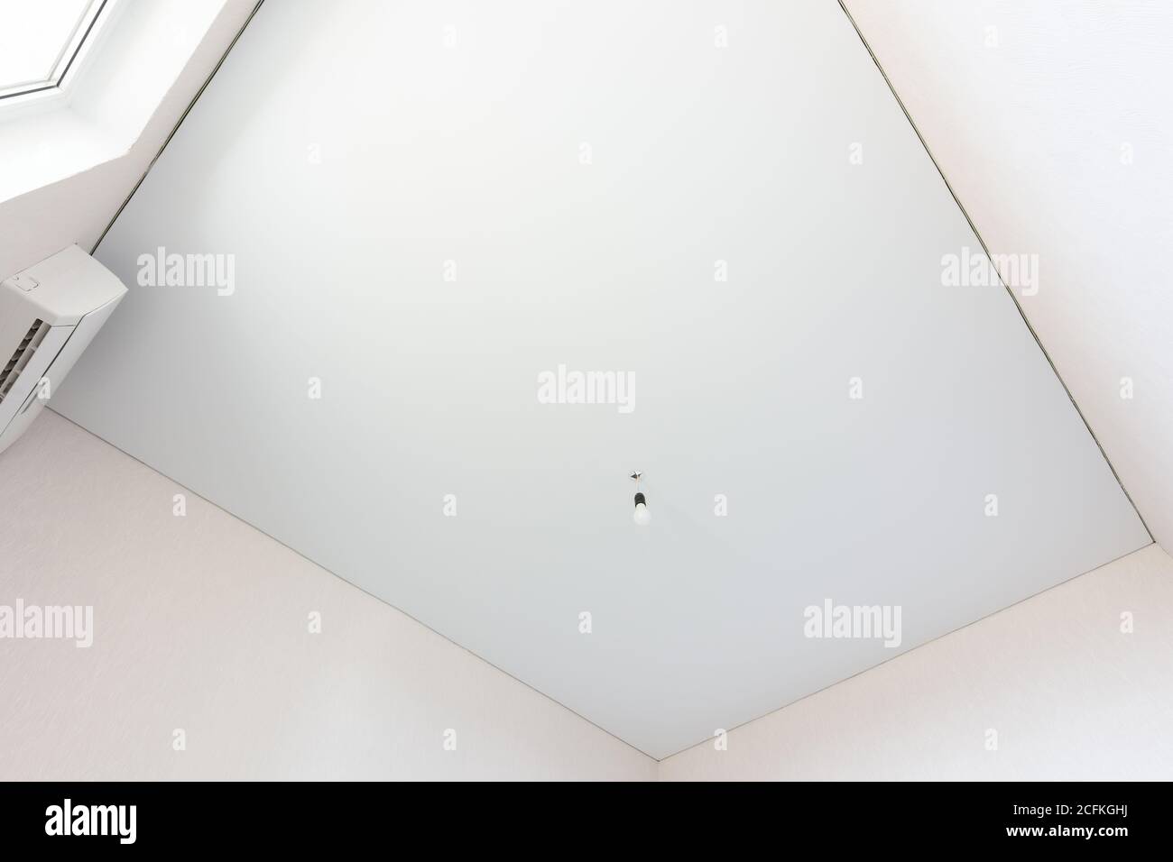 Stretch white ceiling in a rectangular room Stock Photo Alamy