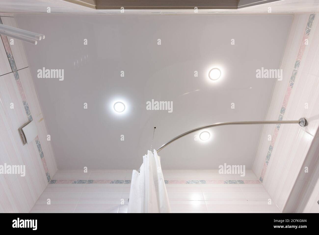 Stretch ceiling with three spotlights in the bathroom Stock Photo