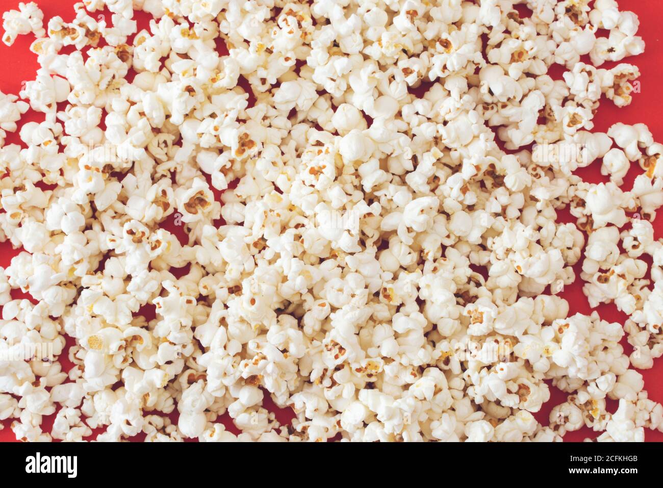 Close-up popcorn on red color background Stock Photo