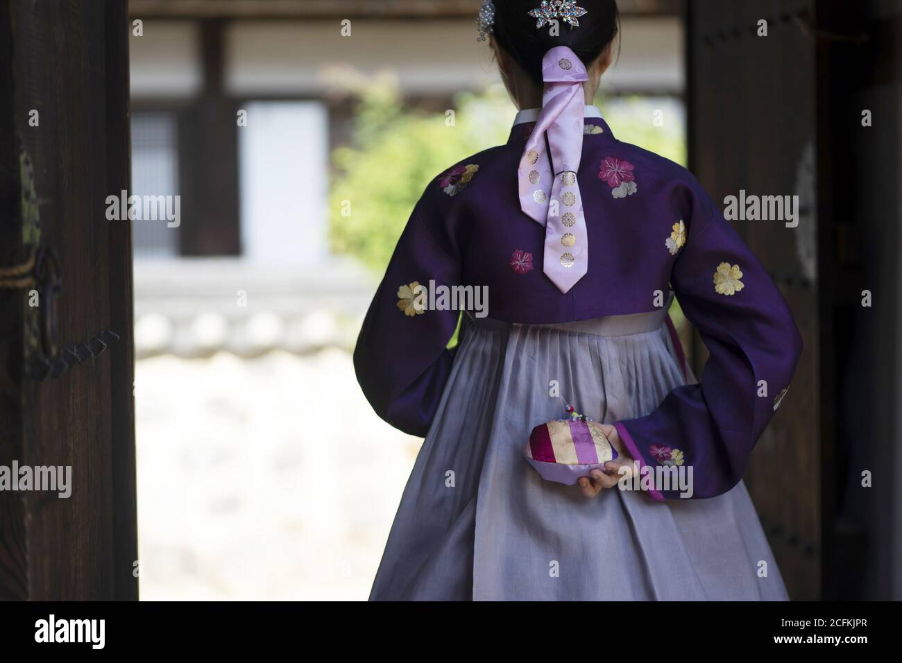 Woman in Korean traditional dress holding lucky bag Stock Photo - Alamy