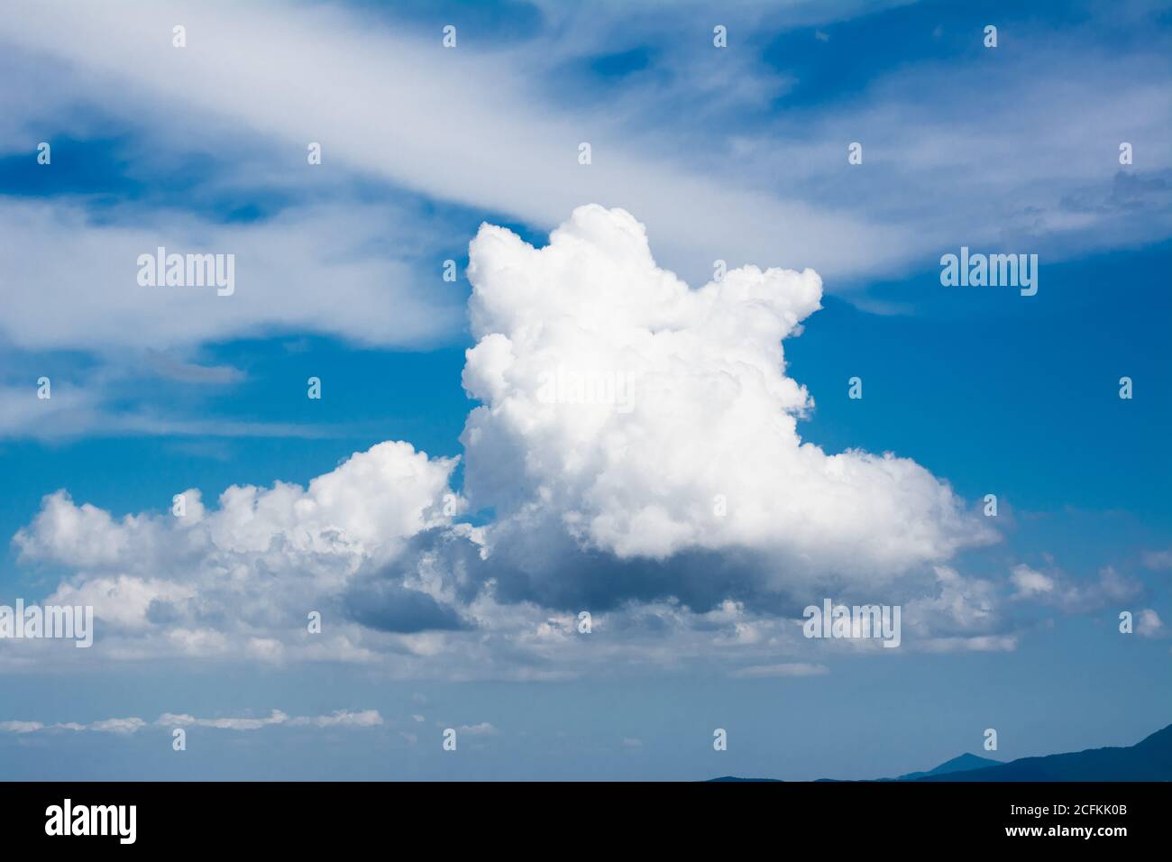 A stratocumulus in the blue sky Stock Photo