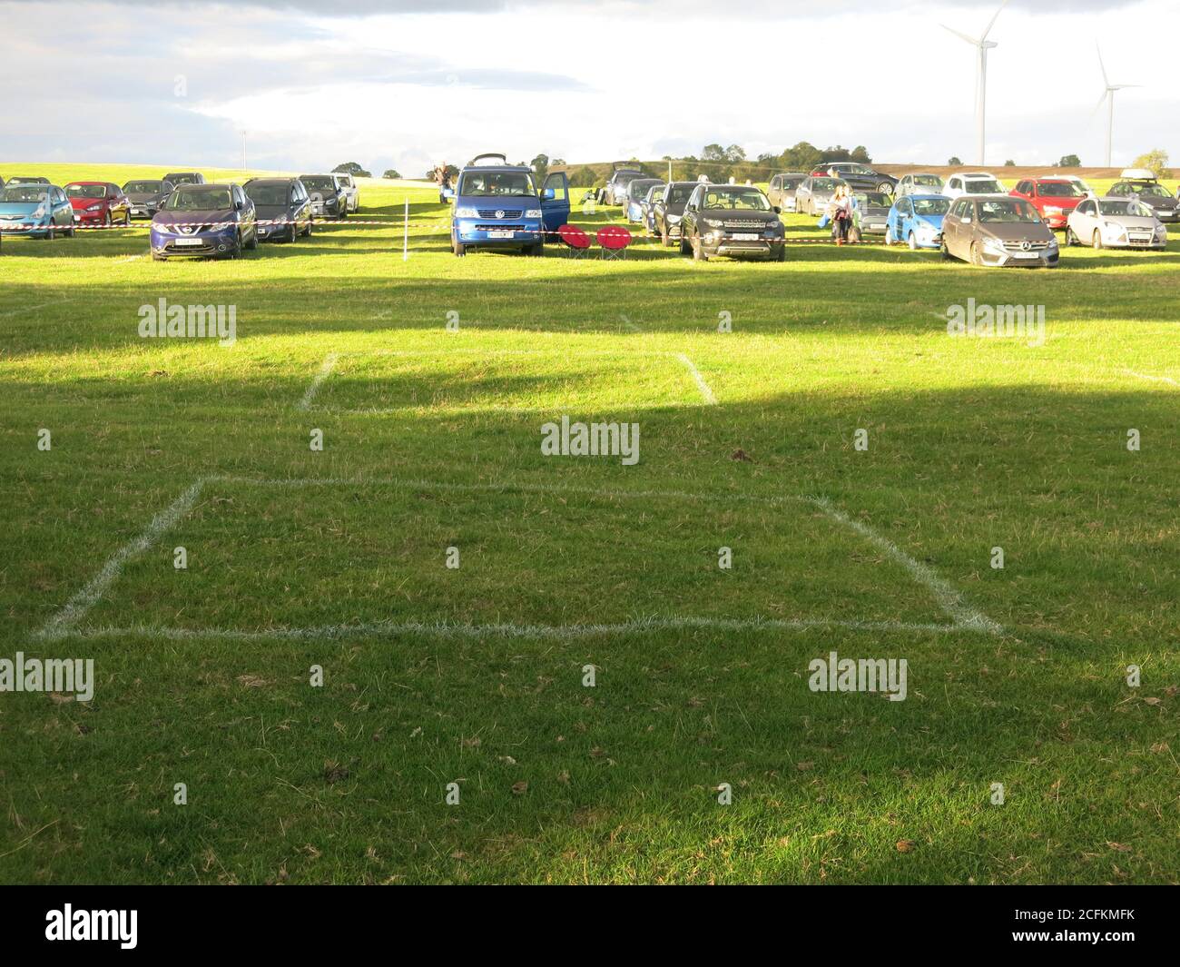 White squares marked out for social distancing of picnickers at a charity film night at Winwick Hall, Northamptonshire; September 2020 Stock Photo