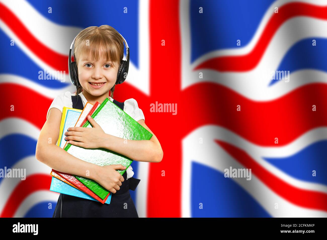 Little girl student with laptop on uk flag background, England Stock Photo Alamy