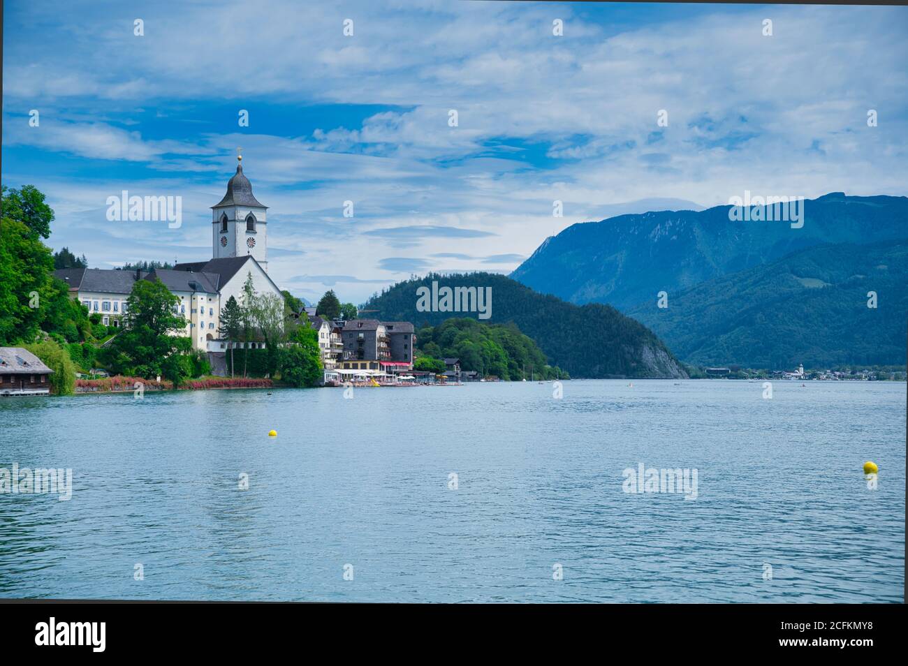 St. Wolfgang, Austria - July 09,2020: the church of the famous village St. Wolfgang in Austria, view over the lake Wolfgang Stock Photo