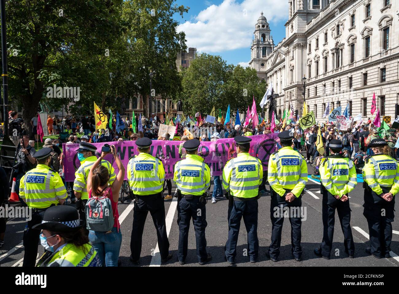 Westminster, London, UK. 1st September, 2020. Rebellion Extinction London protest, first of 10 days of planned climate change actions. Earlier XR protestors had marched with placards and banners from Trafalgar Square and occupied Parliament Square and the roads encircling it. Protestors were calling on Parliament to back the Climate and Ecological Emergency Bill (CEE Bill). As time progressed the Metropolitan Police made arrests, clearing the area in front of Parliament, and some protesters started to leave. Multiple protests were planned to take place around the UK. Credit: Stephen Bell/Alamy Stock Photo