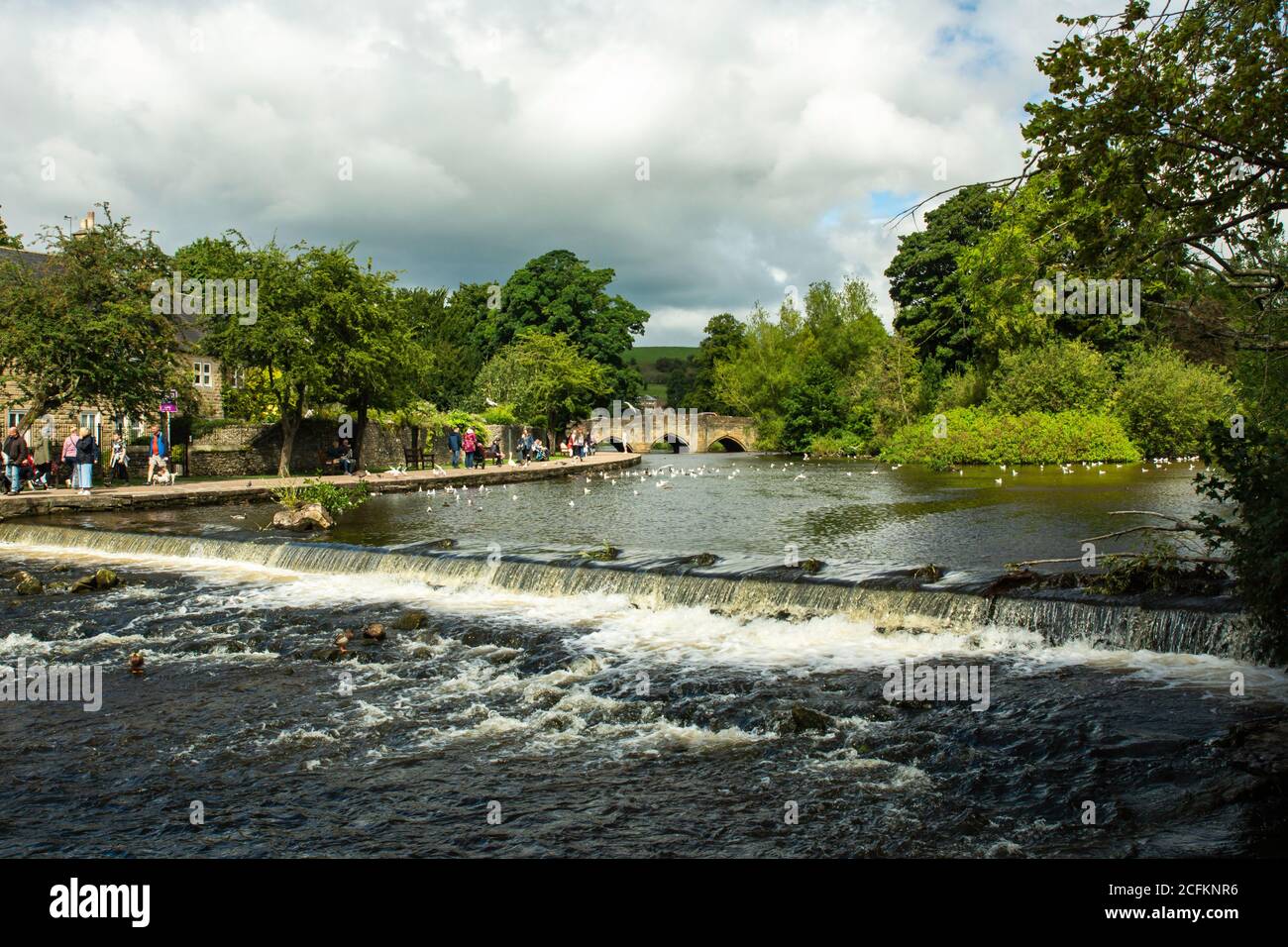 The river wye running through the village of Bakewell in the Derbyshire Dales England Stock Photo