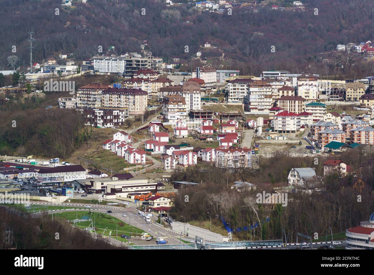 Russia, Krasnodarskiy Kray, Sochi - March 09.2018: top view of chaotic low-rise buildings in the area of Maly Ruchey resort town on a Sunny spring day Stock Photo